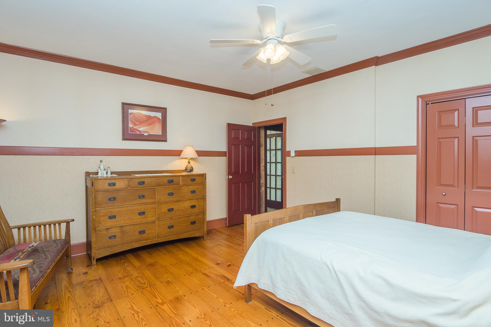 3387 Allen Road Eden, MD 21822 - Photo 28 of 67 a bedroom with a bed a dresser and a chandelier