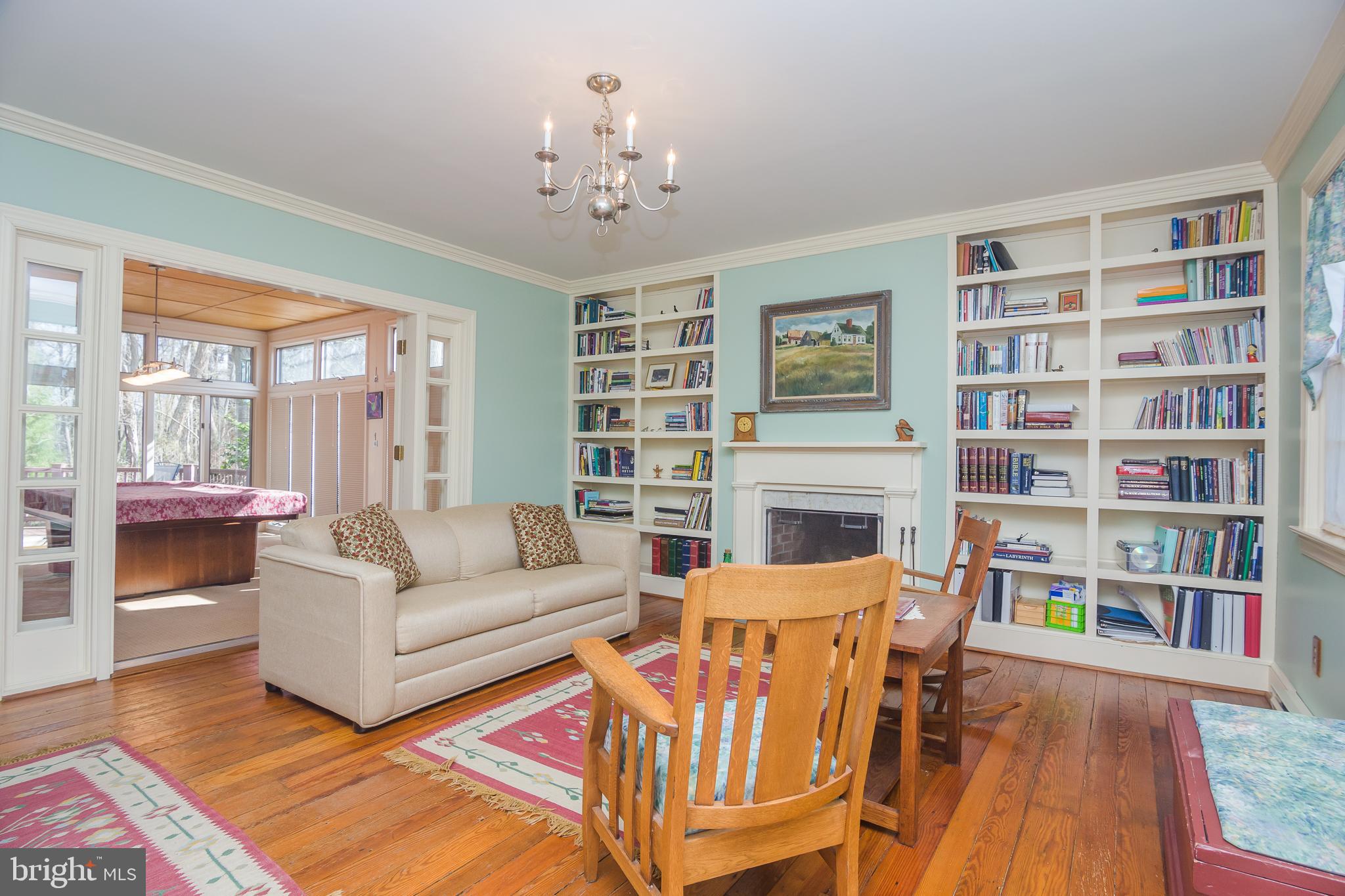 3387 Allen Road Eden, MD 21822 - Photo 7 of 67 a living room with fireplace furniture and a book shelf