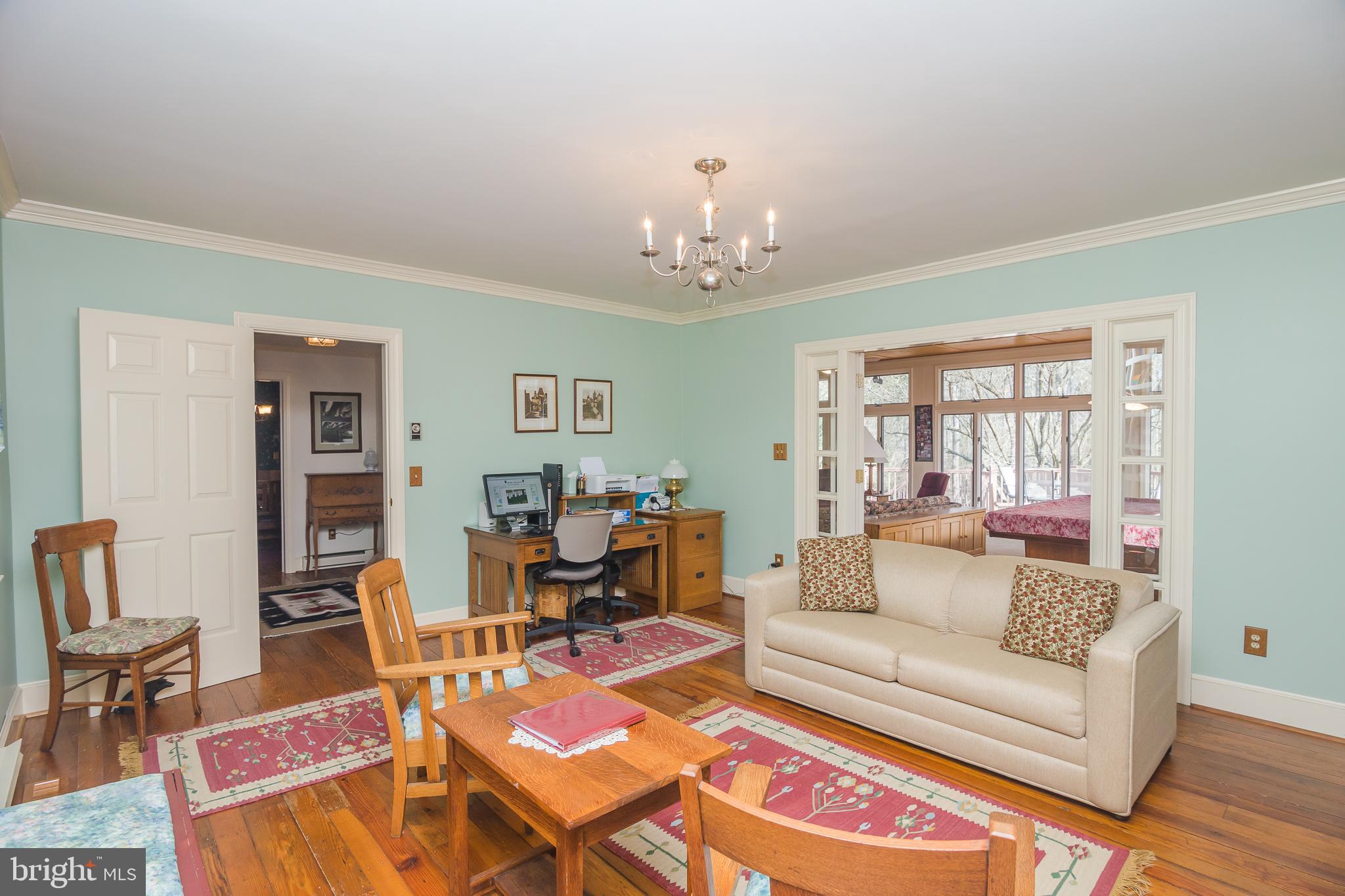 3387 Allen Road Eden, MD 21822 - Photo 8 of 67 a living room with furniture dining table and a chandelier
