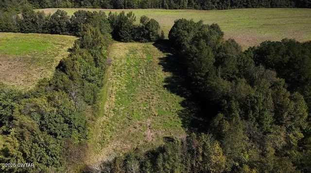 a view of a lake with a yard