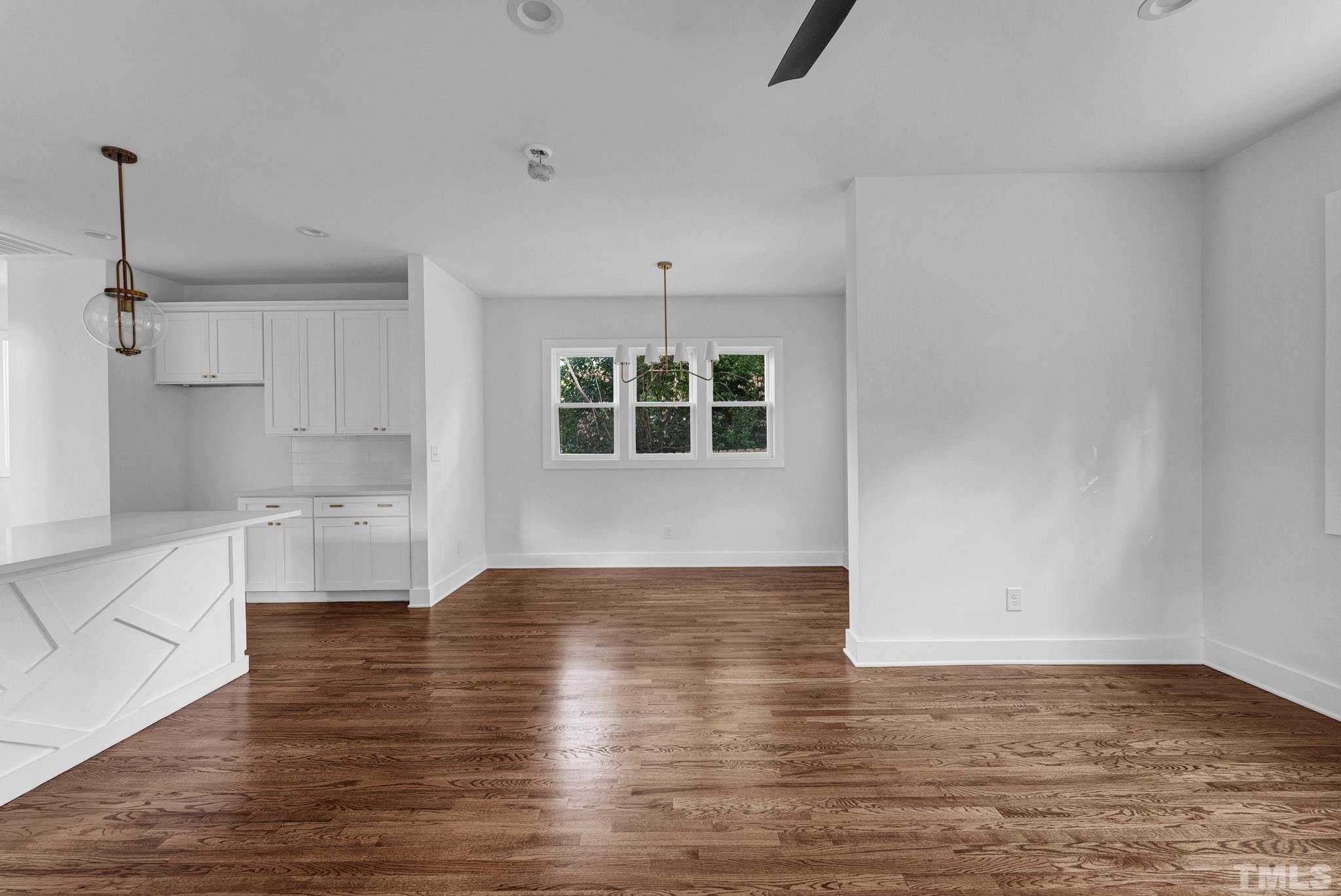 2311 Poole Road Raleigh, NC 27610 - Photo 16 of 29 a view of a kitchen with wooden floor and a sink