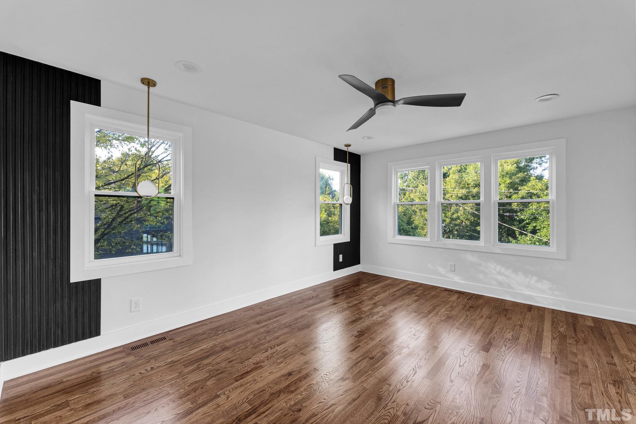 2311 Poole Road Raleigh, NC 27610 - Photo 18 of 29 a view of an empty room with wooden floor and a window