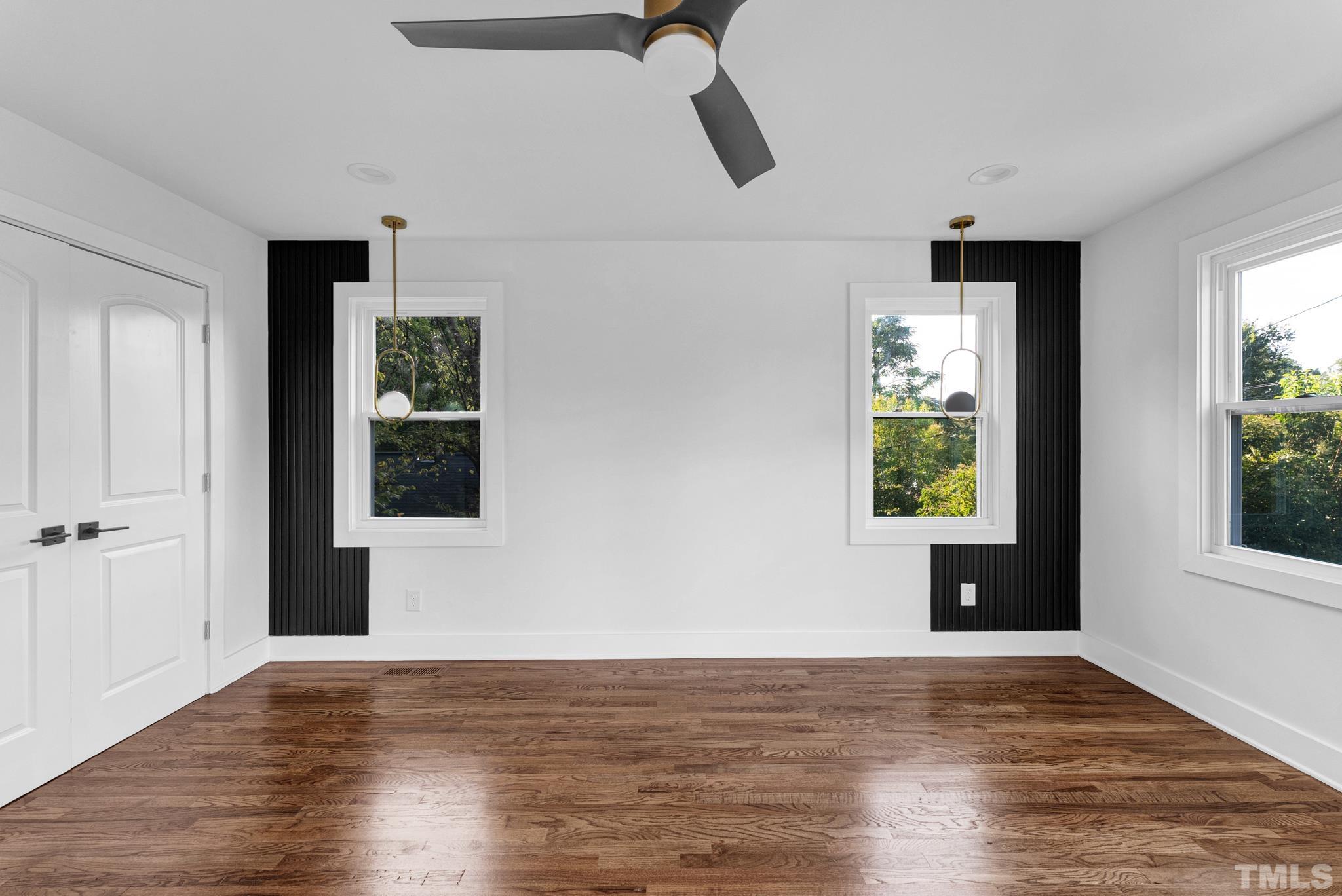 2311 Poole Road Raleigh, NC 27610 - Photo 19 of 29 a view of an empty room with wooden floor and a window