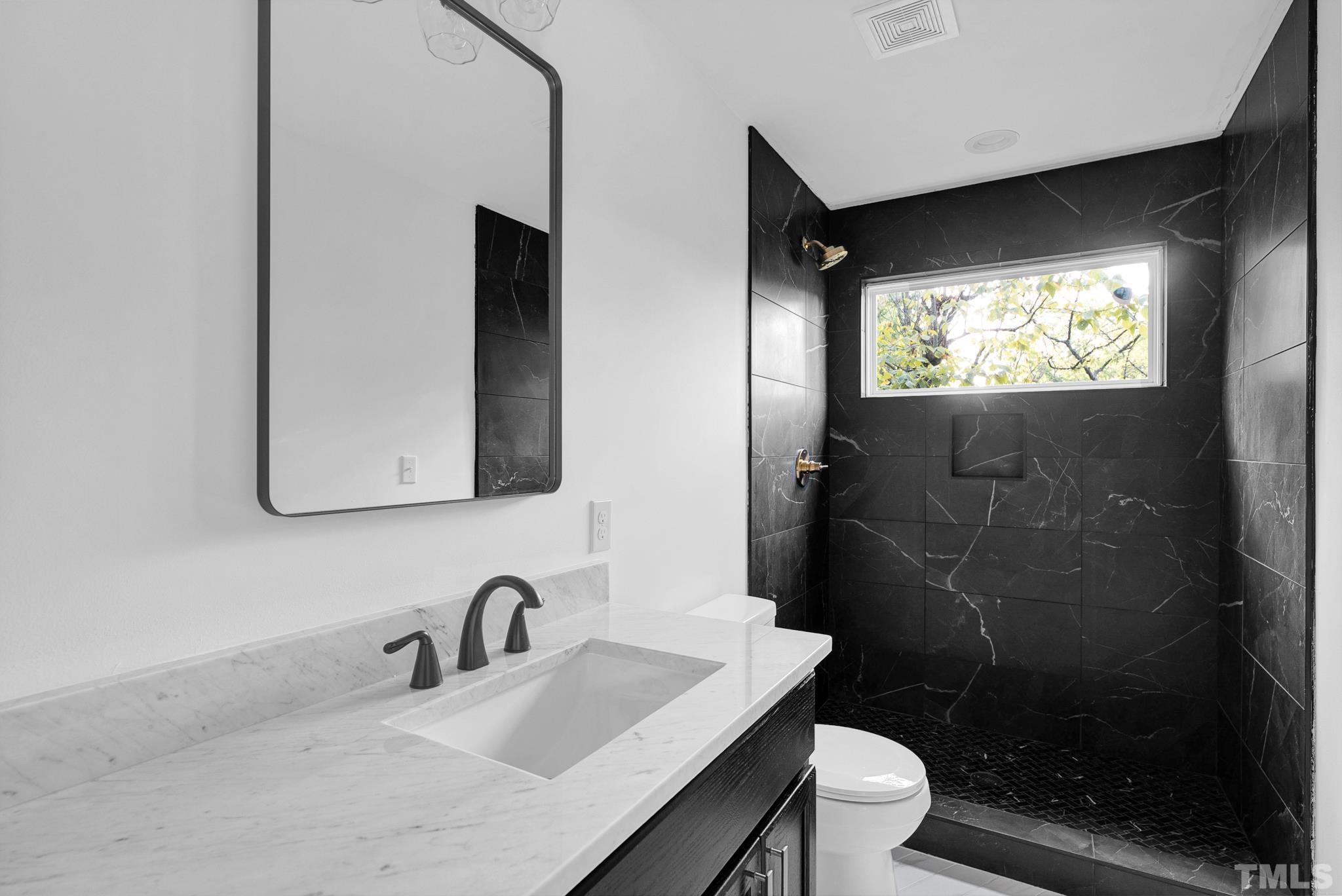 2311 Poole Road Raleigh, NC 27610 - Photo 21 of 29 a bathroom with a sink and a toilet