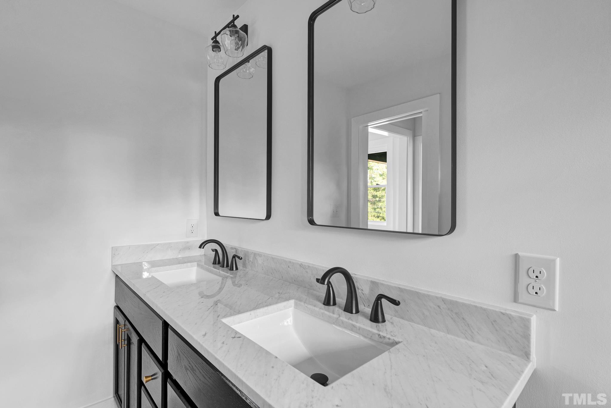 2311 Poole Road Raleigh, NC 27610 - Photo 22 of 29 a bathroom with mirror a sink and mirror