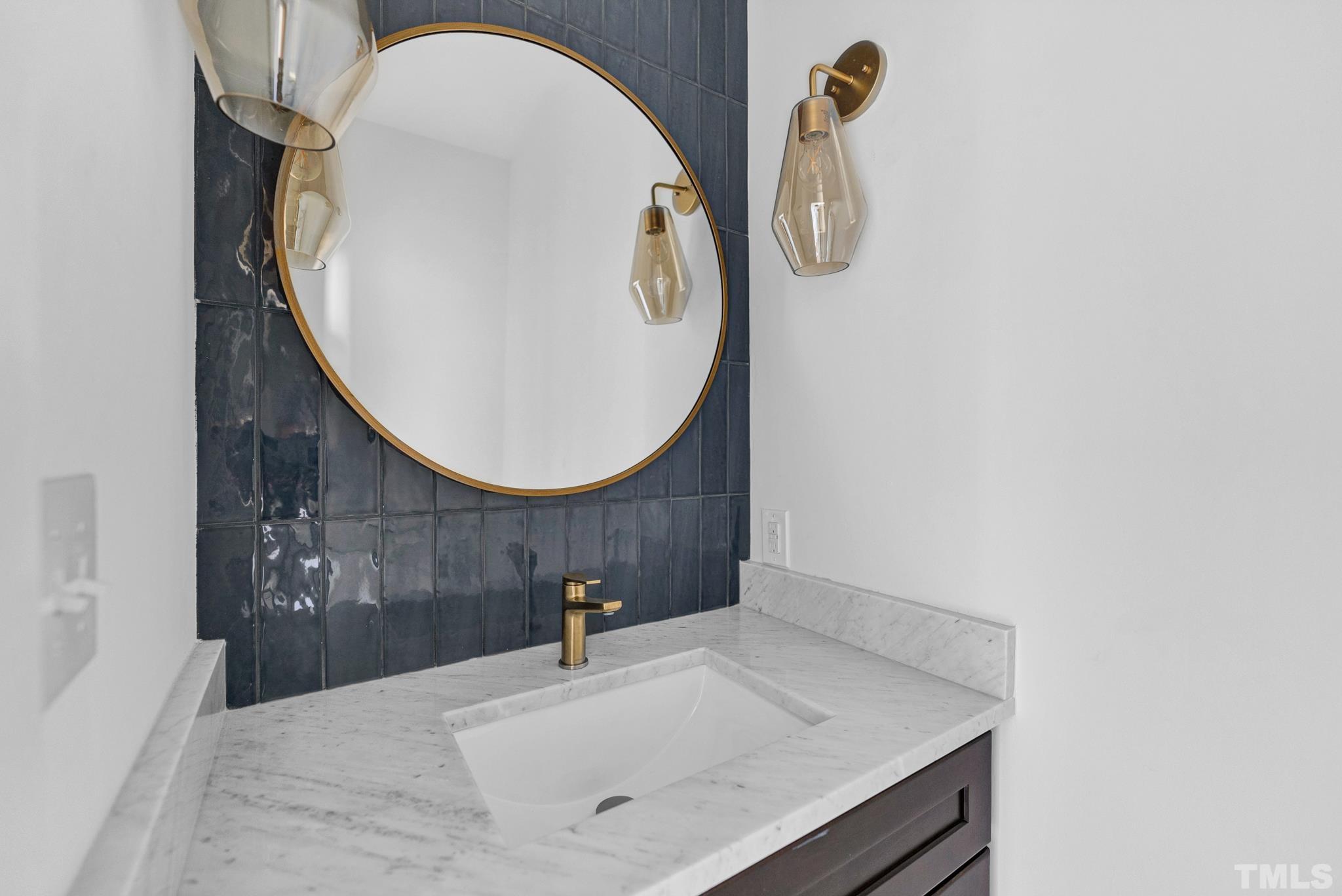2311 Poole Road Raleigh, NC 27610 - Photo 28 of 29 a bathroom with a sink and mirror