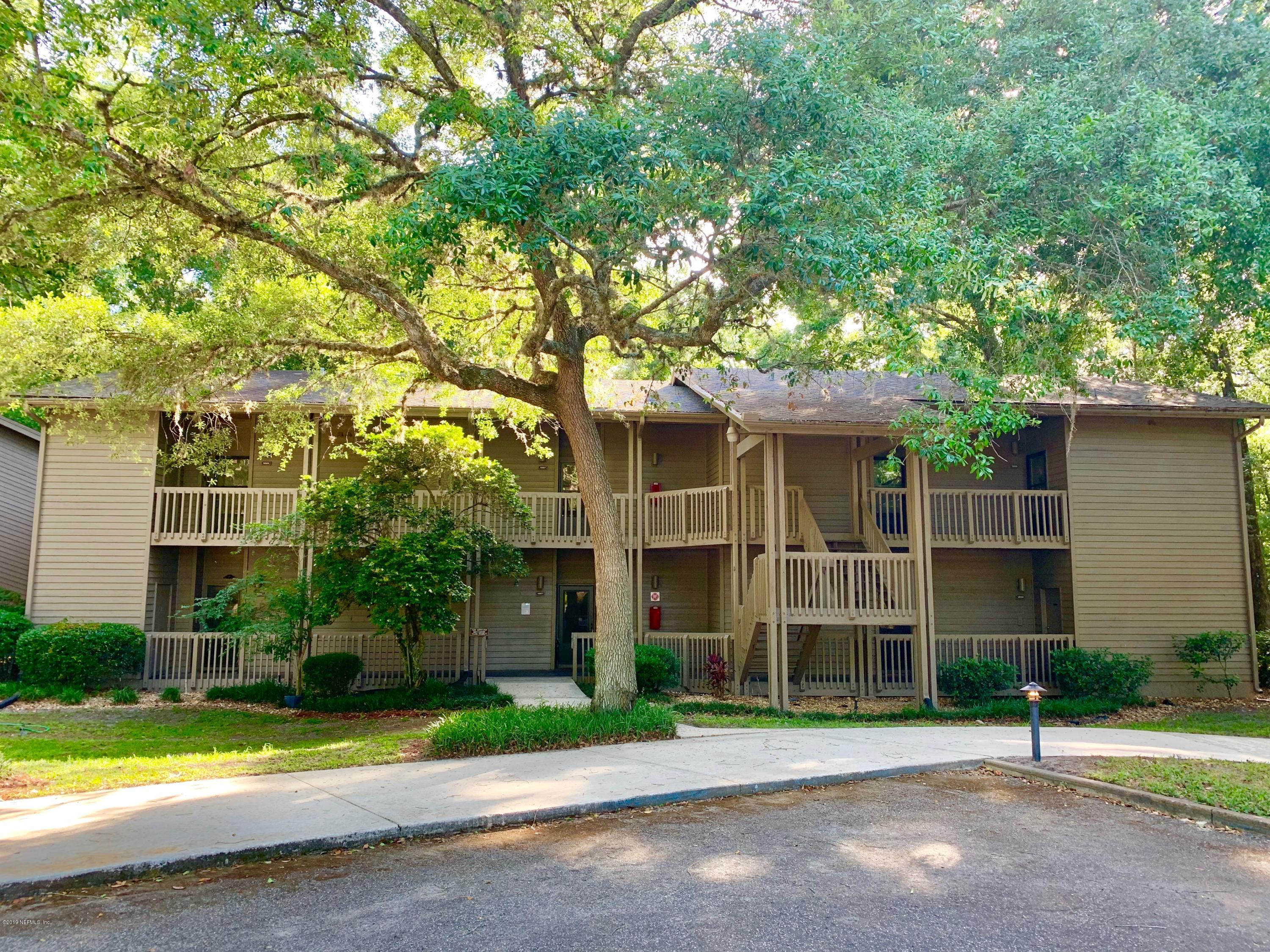 a view of street with large trees