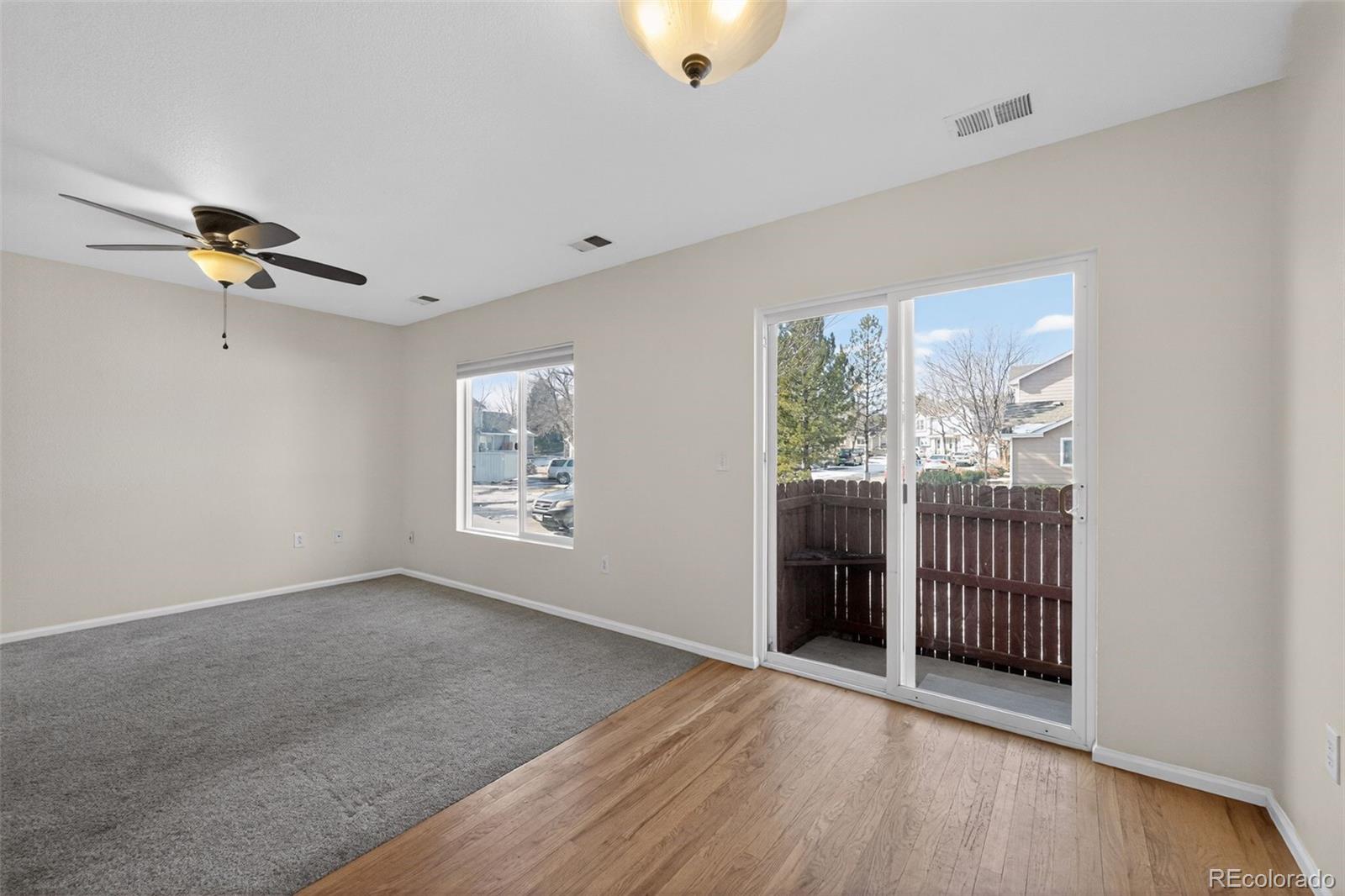 6603 Autumn Ridge Drive, Unit 2 Fort Collins, CO 80525 - Photo 16 of 33 a view of an empty room with glass door