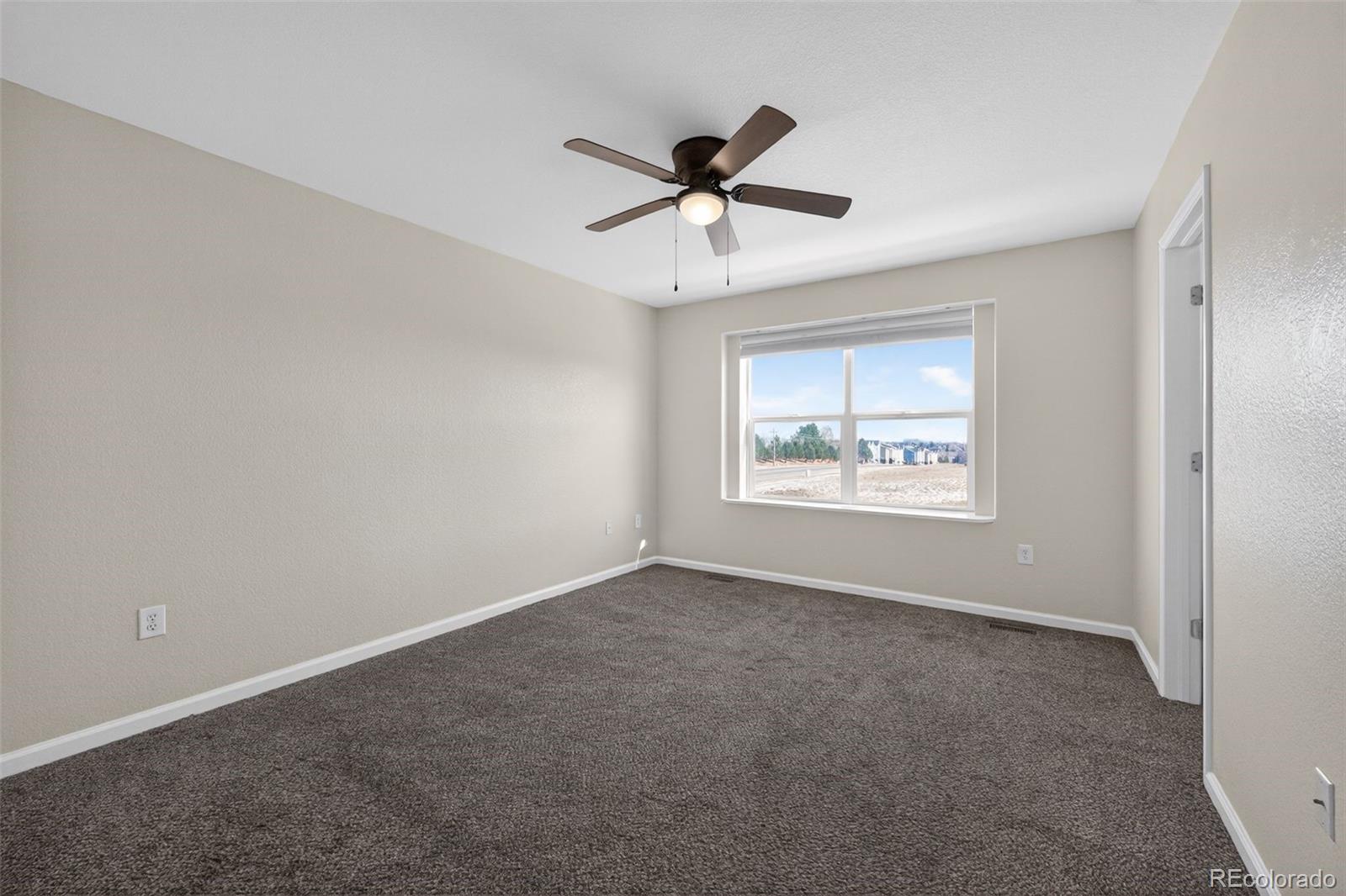 6603 Autumn Ridge Drive, Unit 2 Fort Collins, CO 80525 - Photo 19 of 33 a view of an empty room with a window