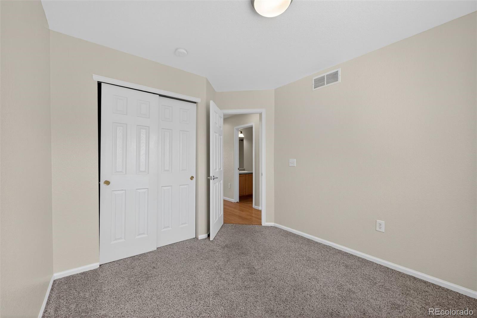 6603 Autumn Ridge Drive, Unit 2 Fort Collins, CO 80525 - Photo 21 of 33 a view of hallway with closet and bathroom