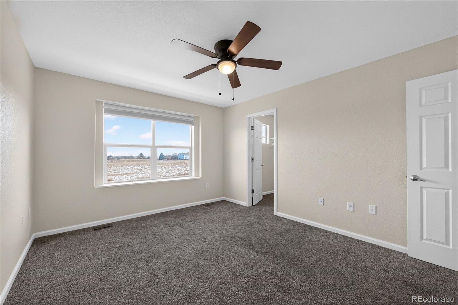 6603 Autumn Ridge Drive, Unit 2 Fort Collins, CO 80525 - Photo 22 of 33 a view of an empty room with a window