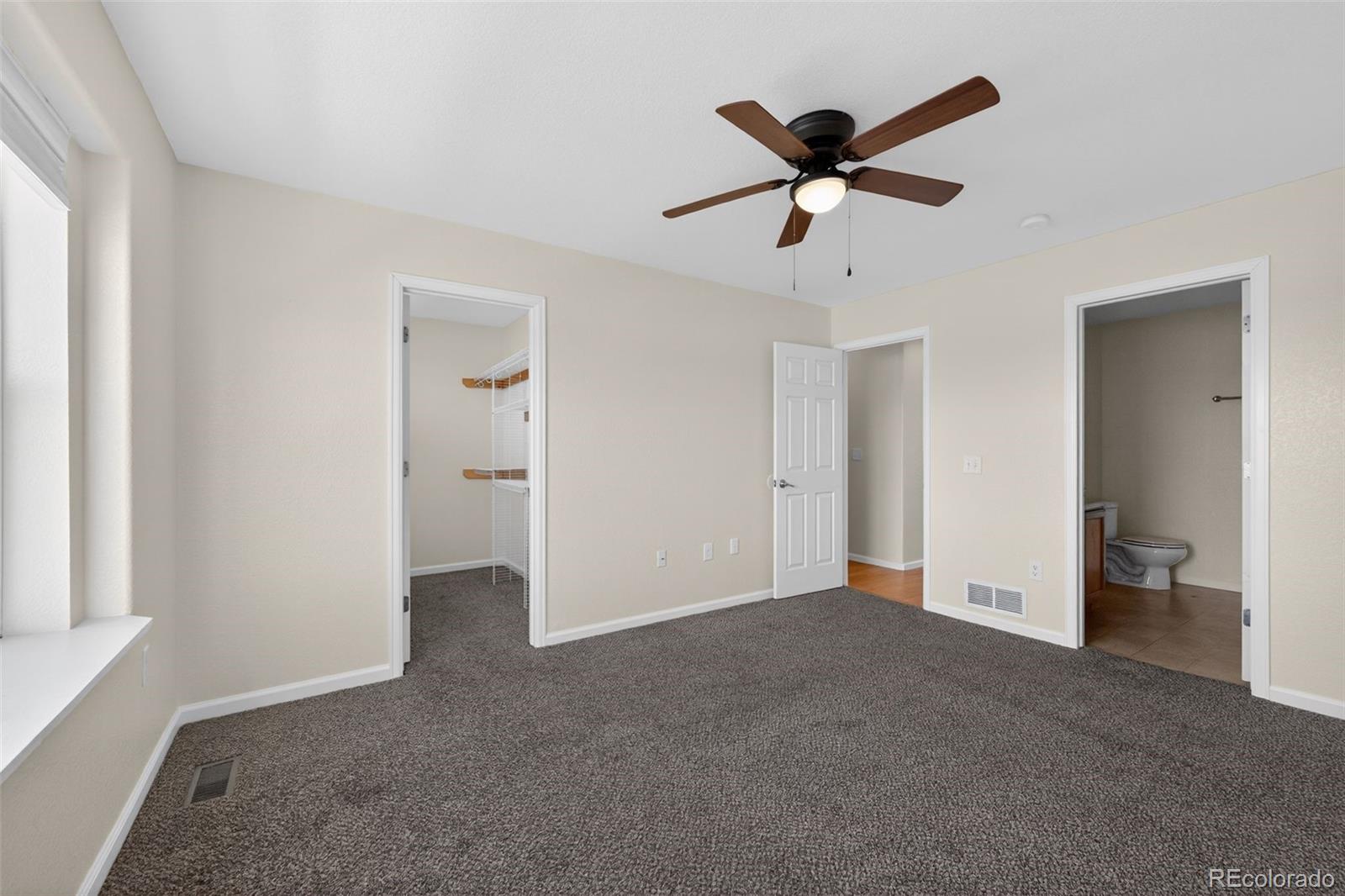 6603 Autumn Ridge Drive, Unit 2 Fort Collins, CO 80525 - Photo 24 of 33 a view of an empty room with a ceiling fan