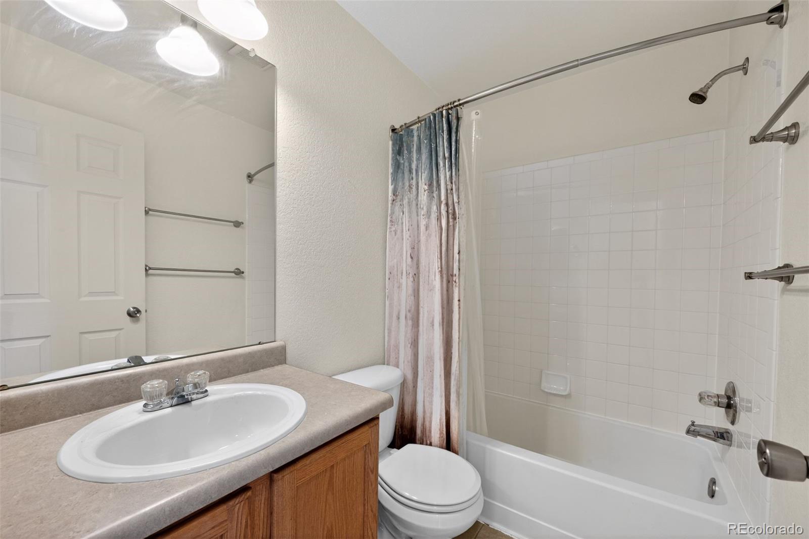 6603 Autumn Ridge Drive, Unit 2 Fort Collins, CO 80525 - Photo 27 of 33 a bathroom with a sink toilet and shower