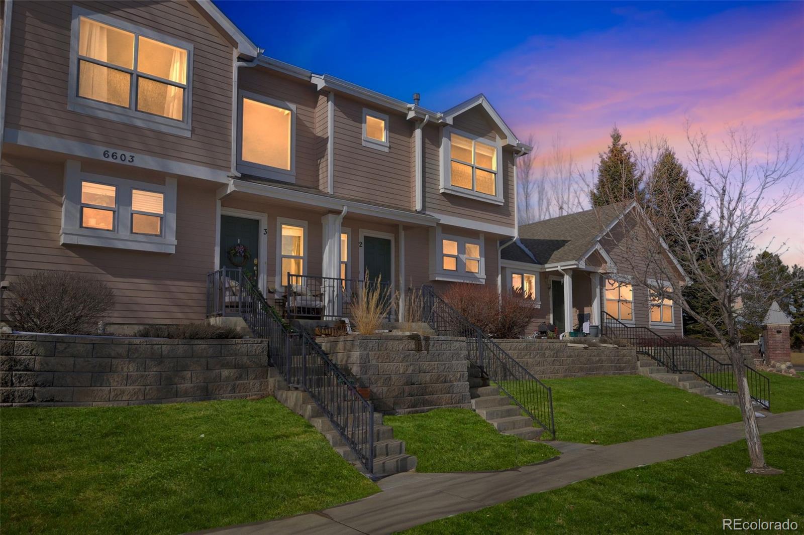 6603 Autumn Ridge Drive, Unit 2 Fort Collins, CO 80525 - Photo 3 of 33 a front view of a house with garden