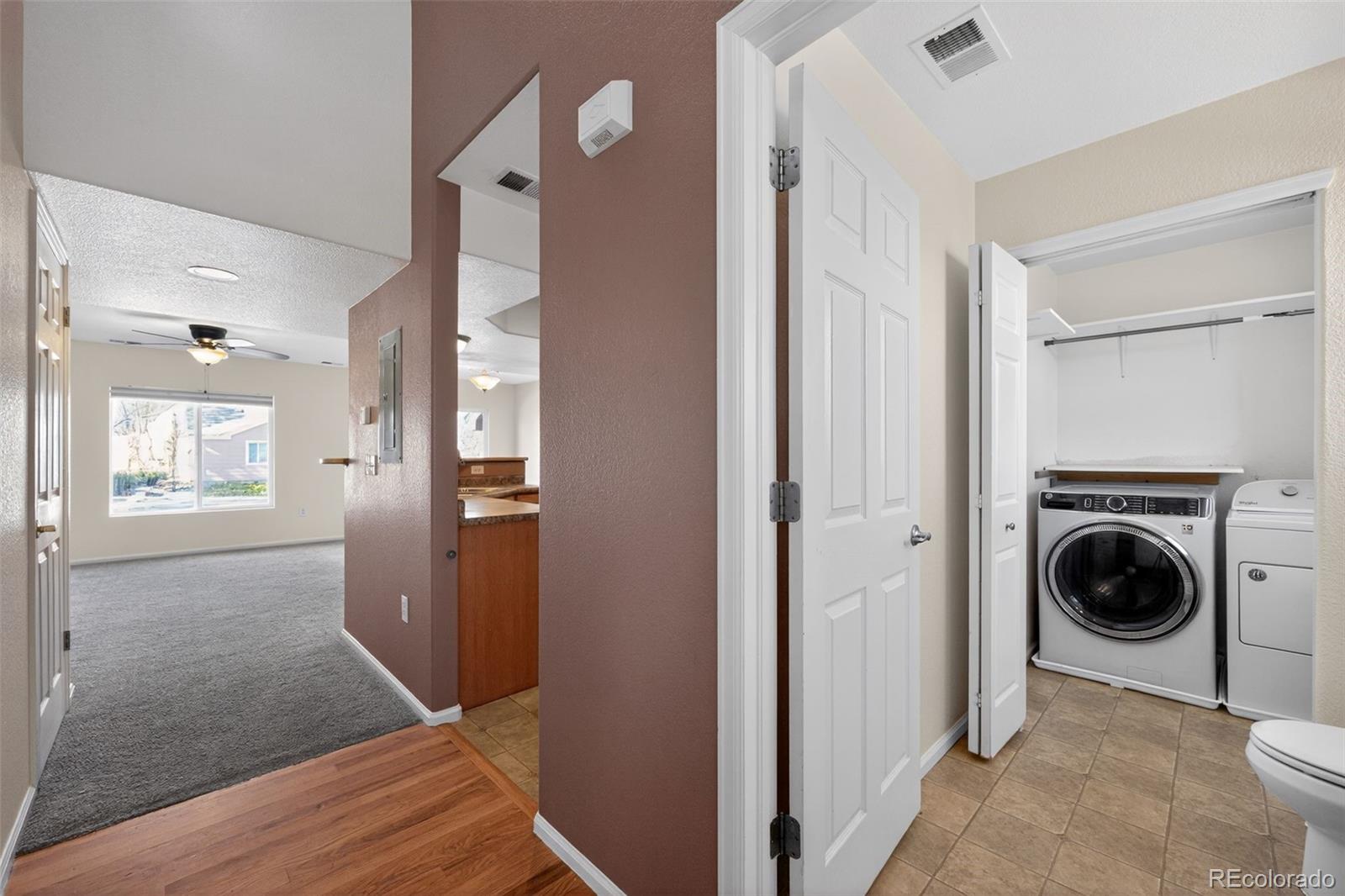 6603 Autumn Ridge Drive, Unit 2 Fort Collins, CO 80525 - Photo 5 of 33 a view of a hallway with washer and dryer