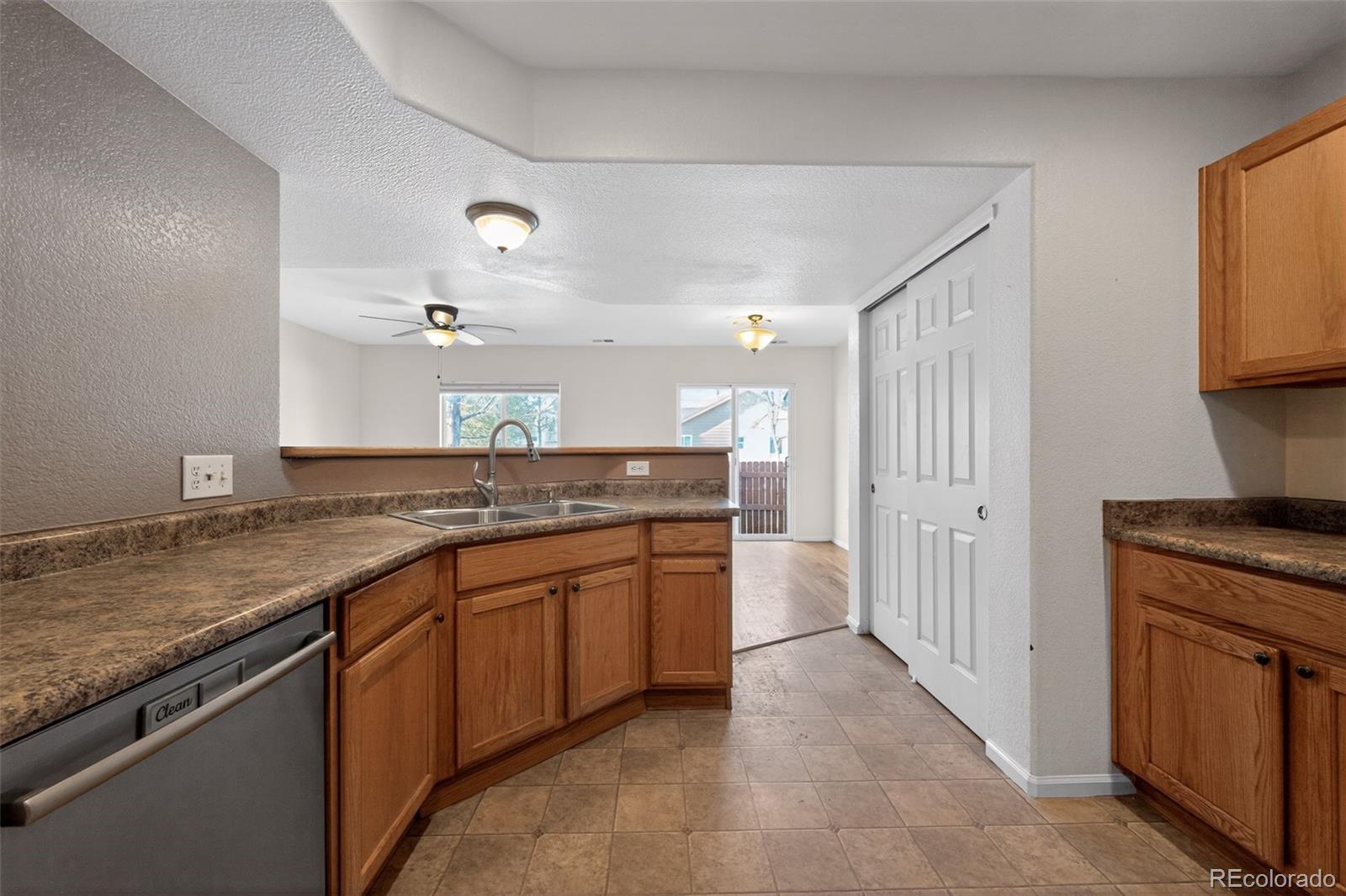 6603 Autumn Ridge Drive, Unit 2 Fort Collins, CO 80525 - Photo 8 of 33 a kitchen with stainless steel appliances granite countertop a sink and a stove