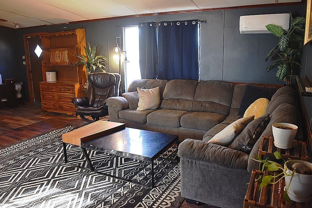 1661 Sassafras Stand Ridge Road Linden, TN 37096 - Photo 6 of 30 a living room with furniture and wooden floor