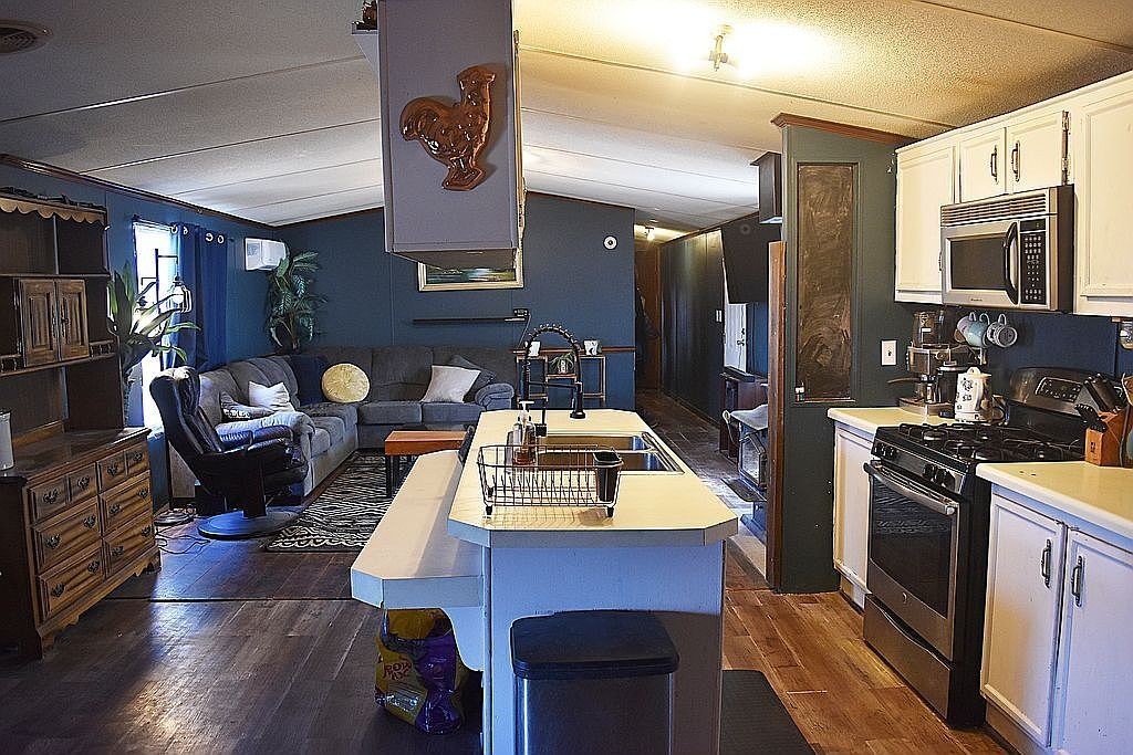 1661 Sassafras Stand Ridge Road Linden, TN 37096 - Photo 7 of 30 a living room with furniture fireplace and flat screen tv