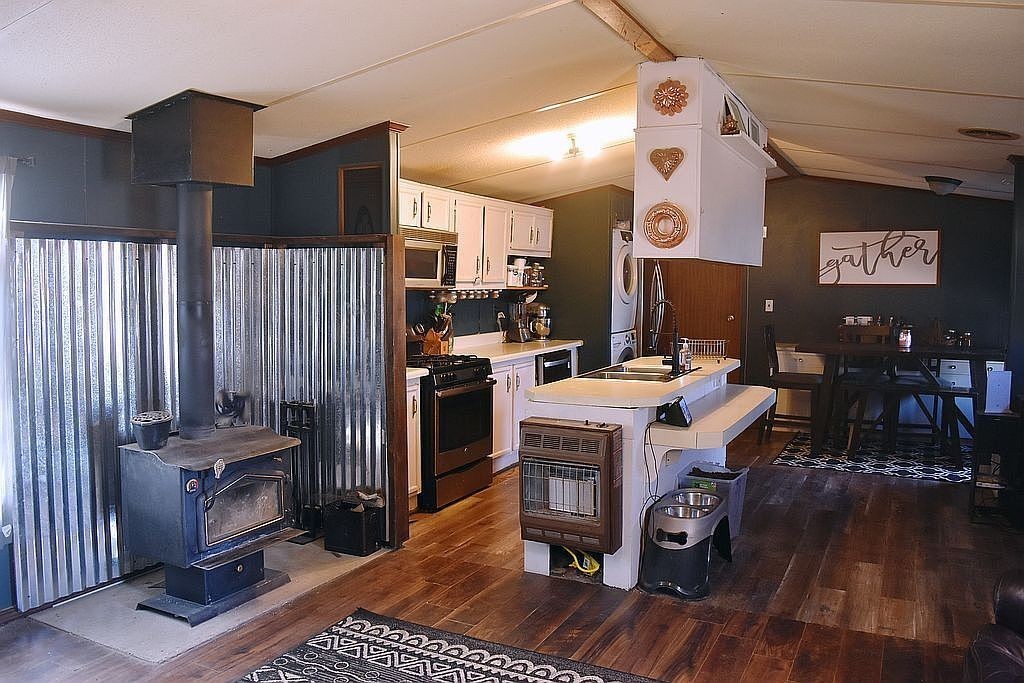 1661 Sassafras Stand Ridge Road Linden, TN 37096 - Photo 8 of 30 a kitchen with a sink and a stove top oven