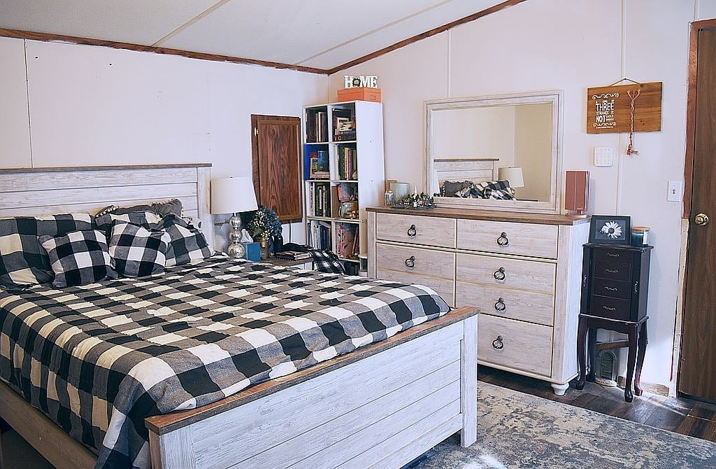 1661 Sassafras Stand Ridge Road Linden, TN 37096 - Photo 10 of 30 a bedroom with a bed and dresser