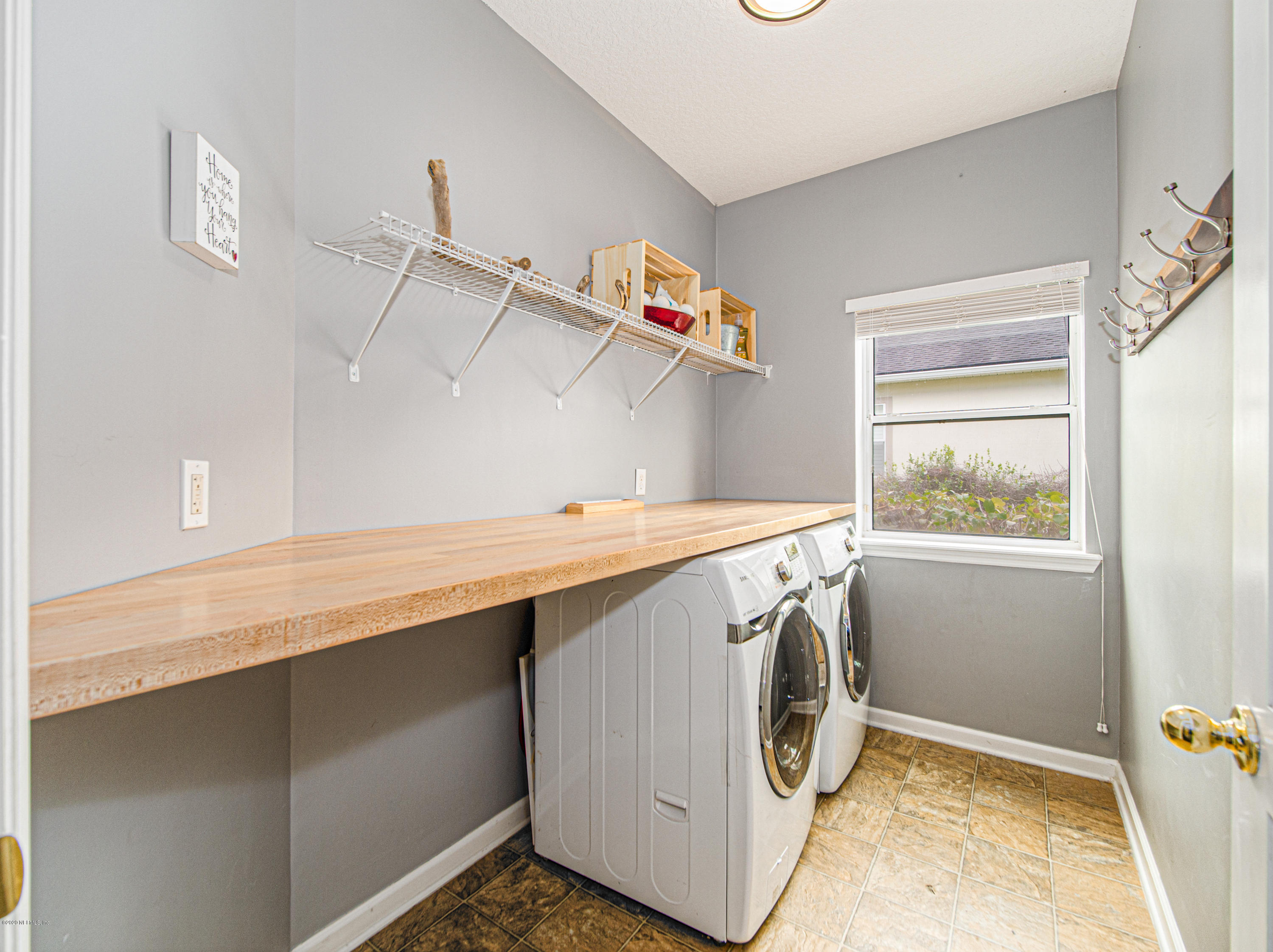 6152 White Tip Road Jacksonville, FL 32258 - Photo 26 of 44 Convenient Shelf In Laundry Room