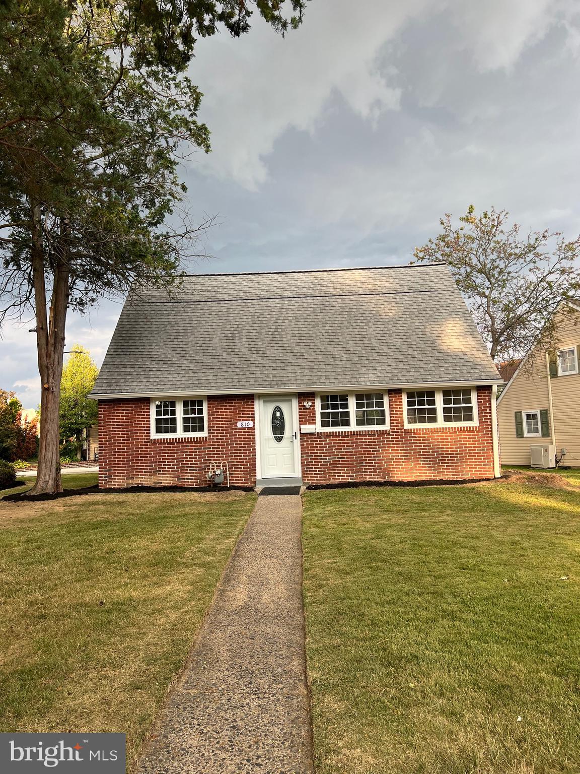 810 Quince Lane Secane, PA 19018 - Photo 2 of 44 a front view of a house with a yard