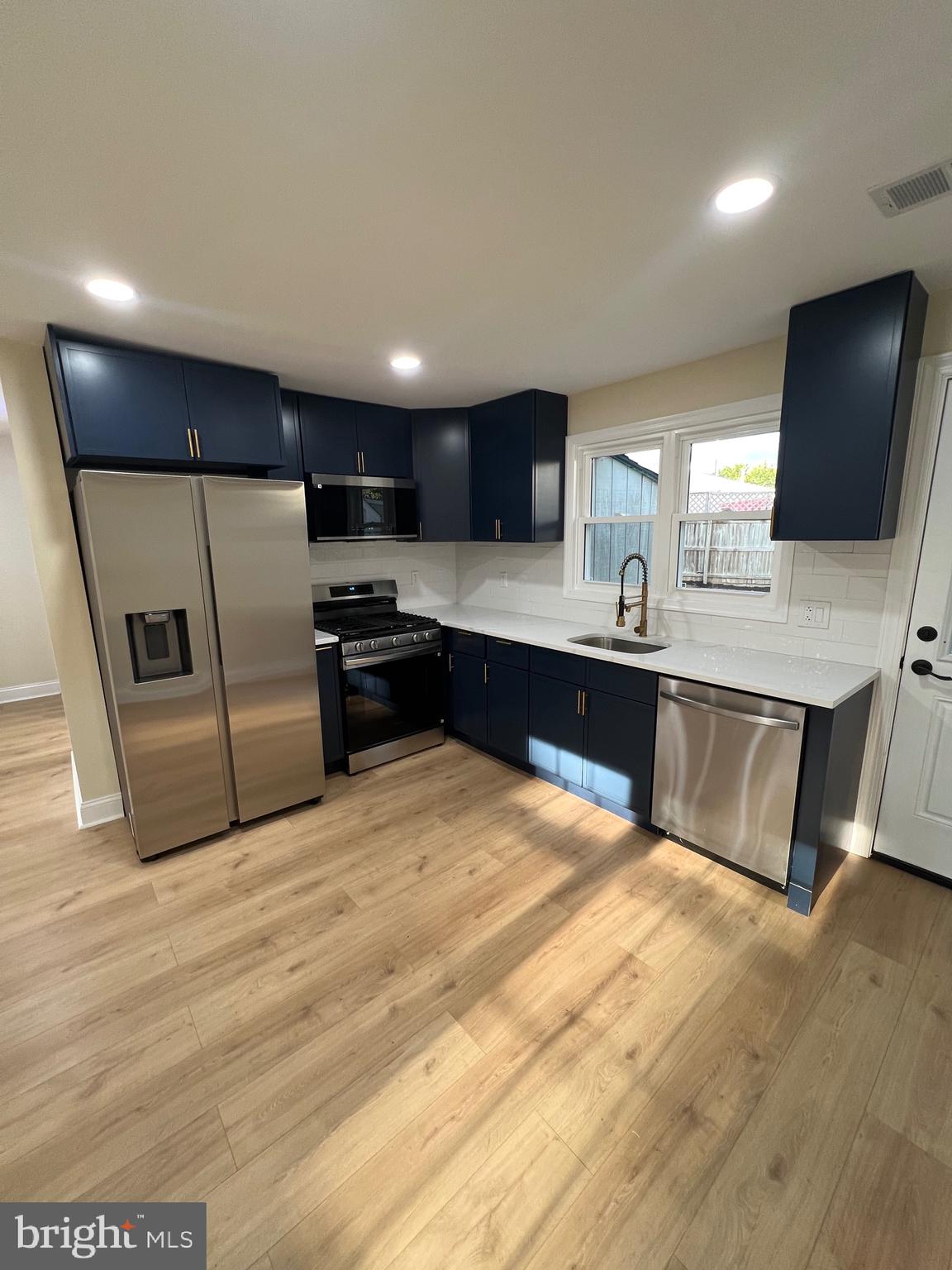 810 Quince Lane Secane, PA 19018 - Photo 24 of 44 a large kitchen with a large counter top stainless steel appliances and cabinets