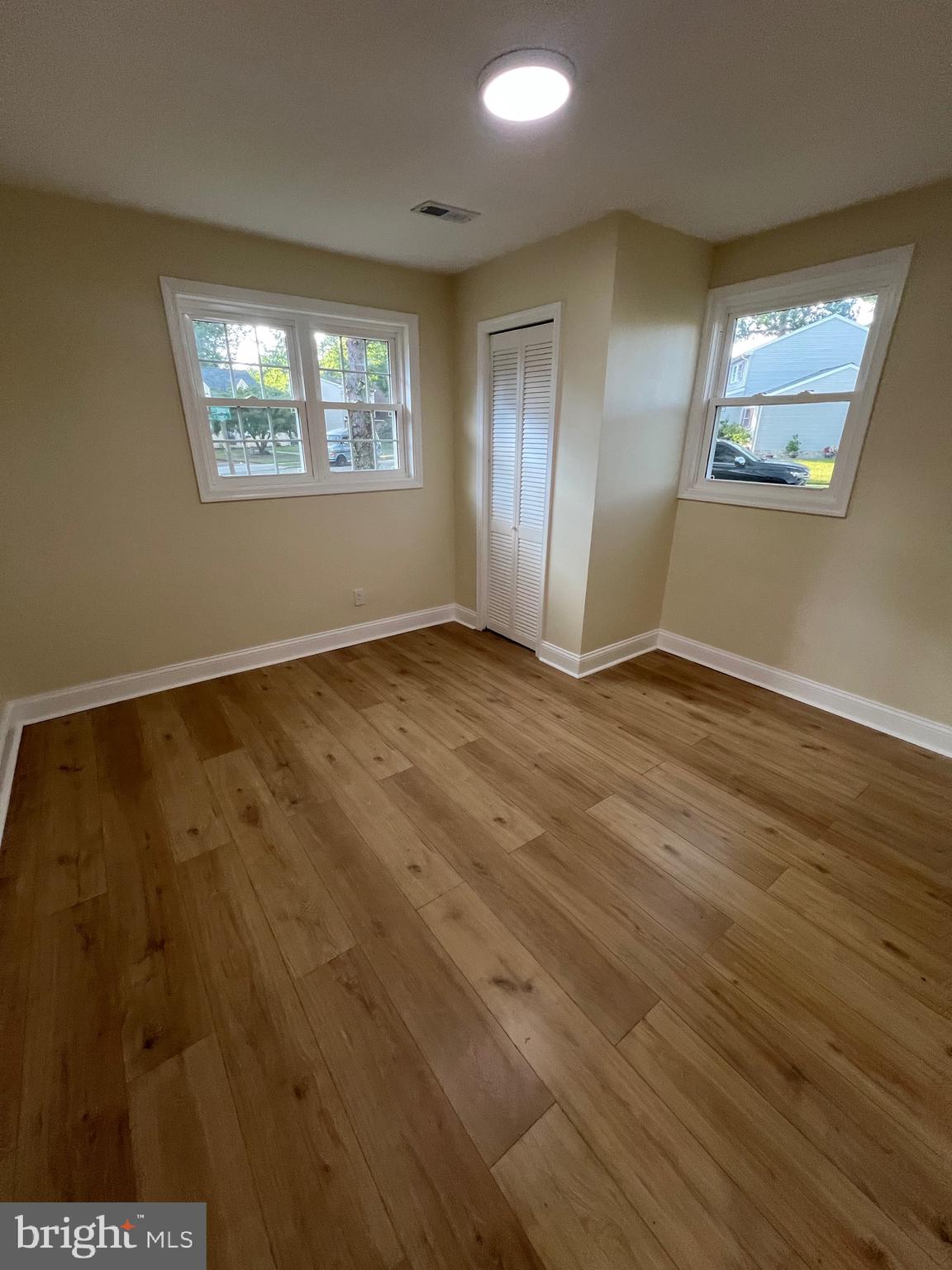 810 Quince Lane Secane, PA 19018 - Photo 33 of 44 a view of an empty room with wooden floor and windows