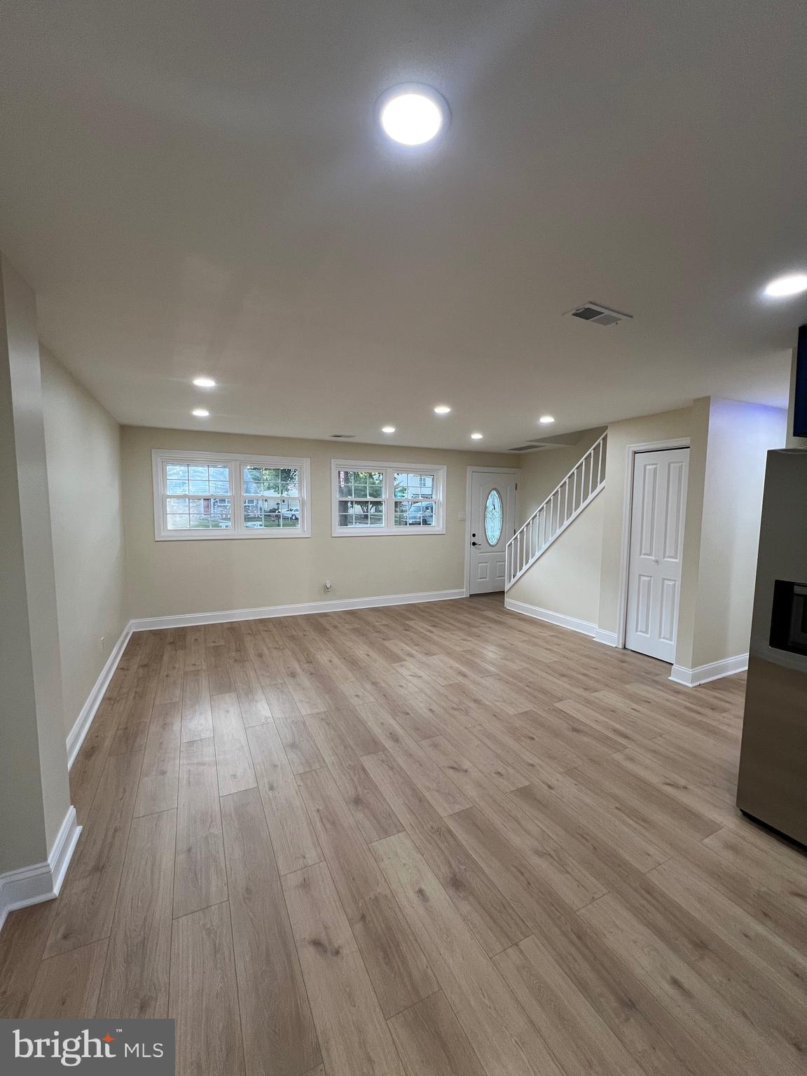 810 Quince Lane Secane, PA 19018 - Photo 37 of 44 an empty room with wooden floor and windows