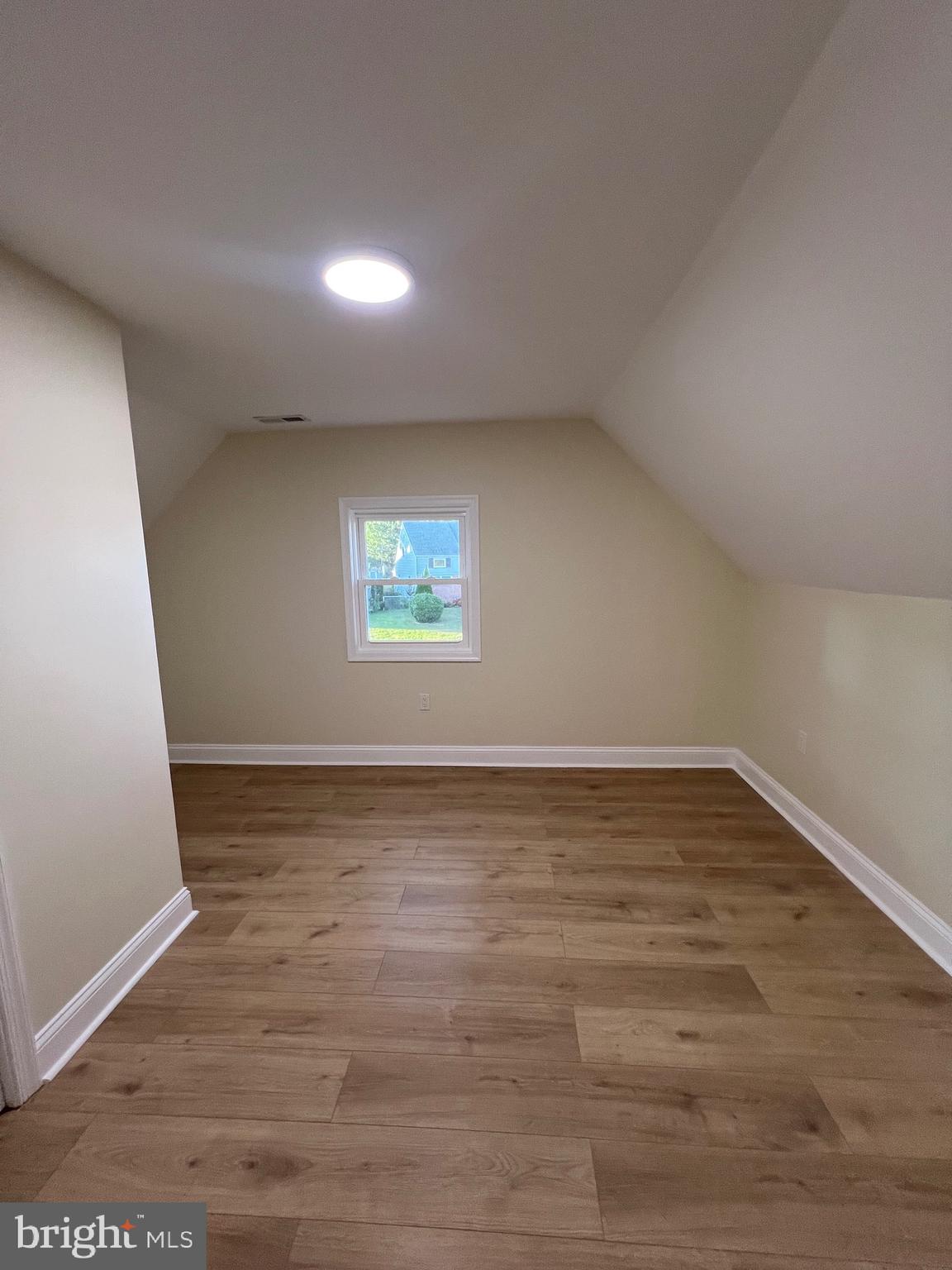 810 Quince Lane Secane, PA 19018 - Photo 42 of 44 a view of an empty room with wooden floor and a window