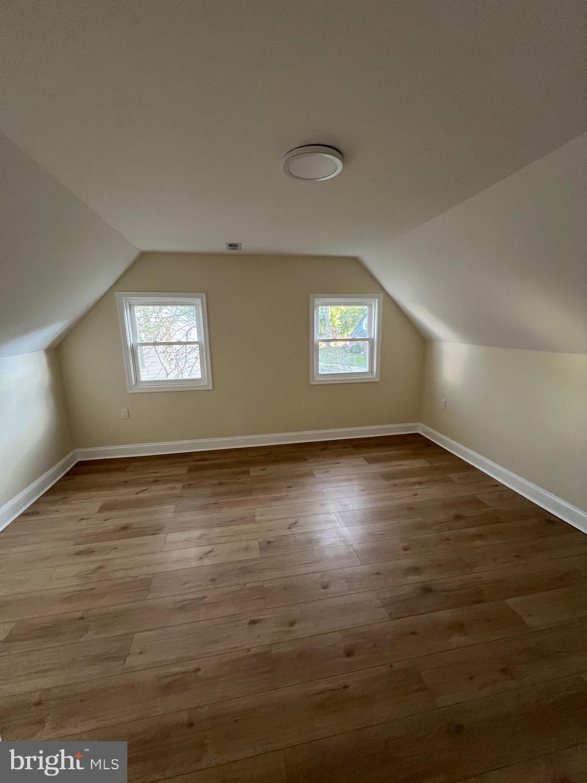 810 Quince Lane Secane, PA 19018 - Photo 44 of 44 an empty room with wooden floor and windows