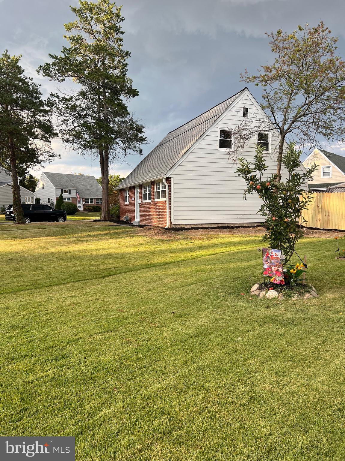 810 Quince Lane Secane, PA 19018 - Photo 7 of 44 a view of a house with a big yard and large trees