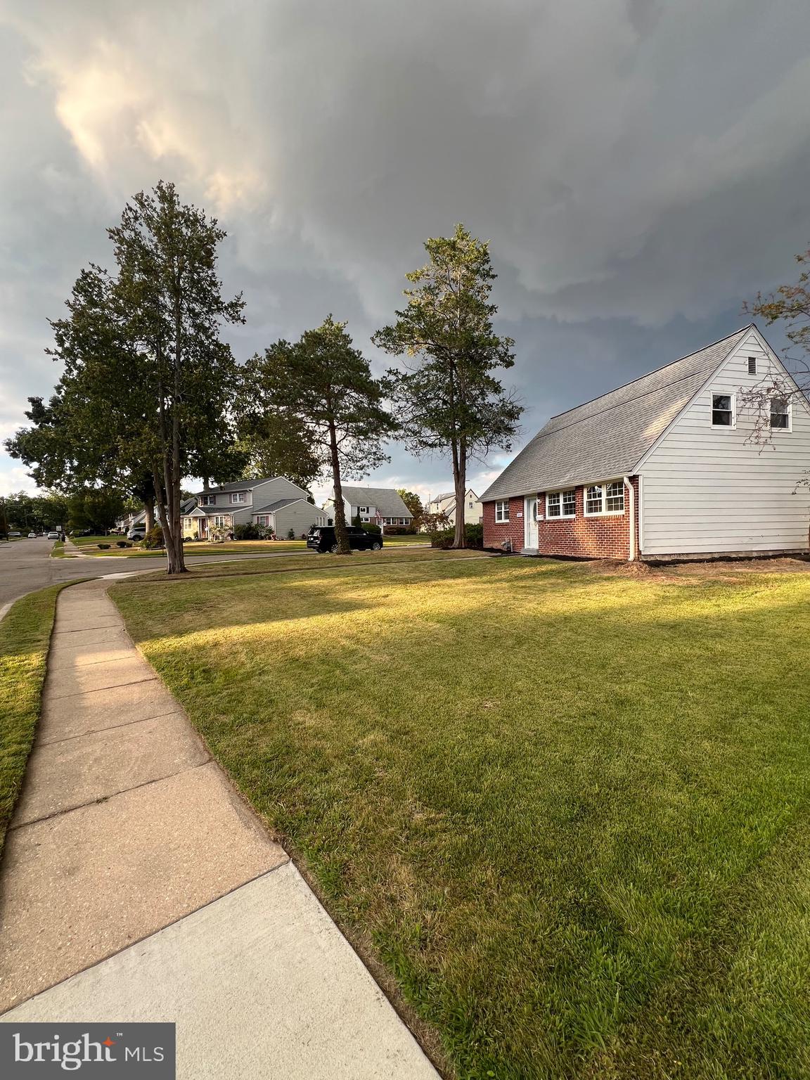 810 Quince Lane Secane, PA 19018 - Photo 8 of 44 a view of a swimming pool with an outdoor space and seating area