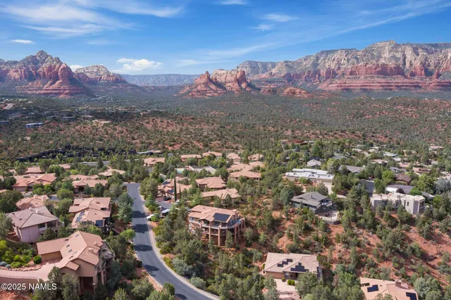 a view of a city with mountains in the background