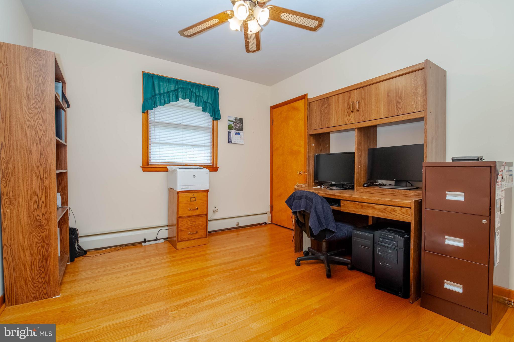 2319 Reckord Road Joppa, MD 21085 - Photo 22 of 45 a view of a workspace with furniture and a window