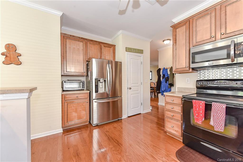 325 Sand Paver Way, Unit 99 Fort Mill, SC 29708 - Photo 13 of 25 a kitchen with stainless steel appliances a refrigerator stove and microwave