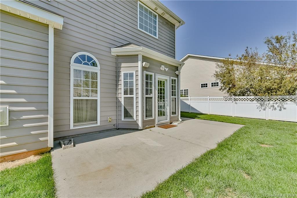 325 Sand Paver Way, Unit 99 Fort Mill, SC 29708 - Photo 23 of 25 a view of a house with a porch and furniture