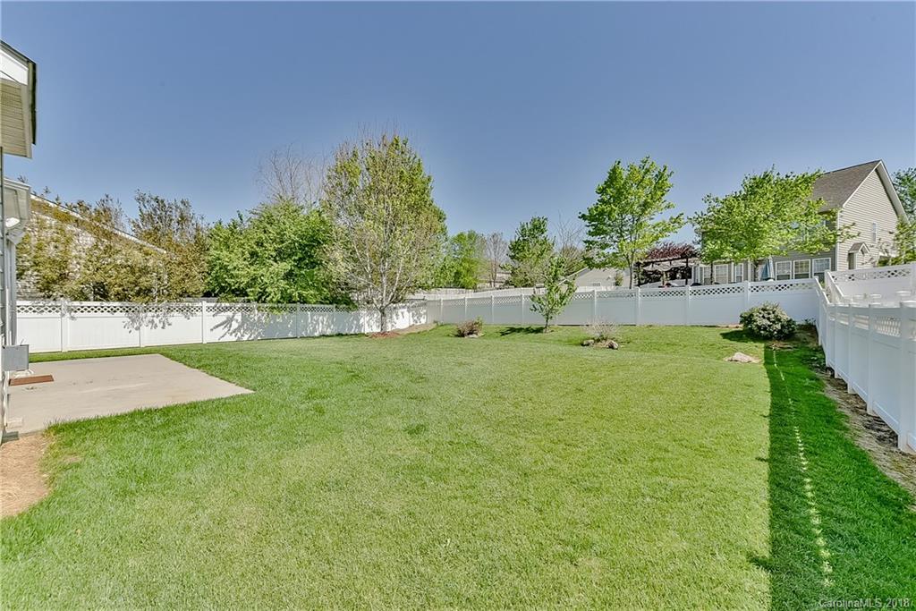 325 Sand Paver Way, Unit 99 Fort Mill, SC 29708 - Photo 24 of 25 a view of yard with swimming pool and green space