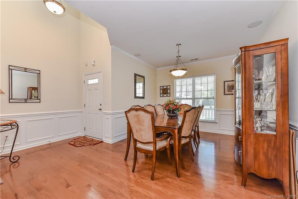 325 Sand Paver Way, Unit 99 Fort Mill, SC 29708 - Photo 4 of 25 a view of a dining room with furniture window and wooden floor