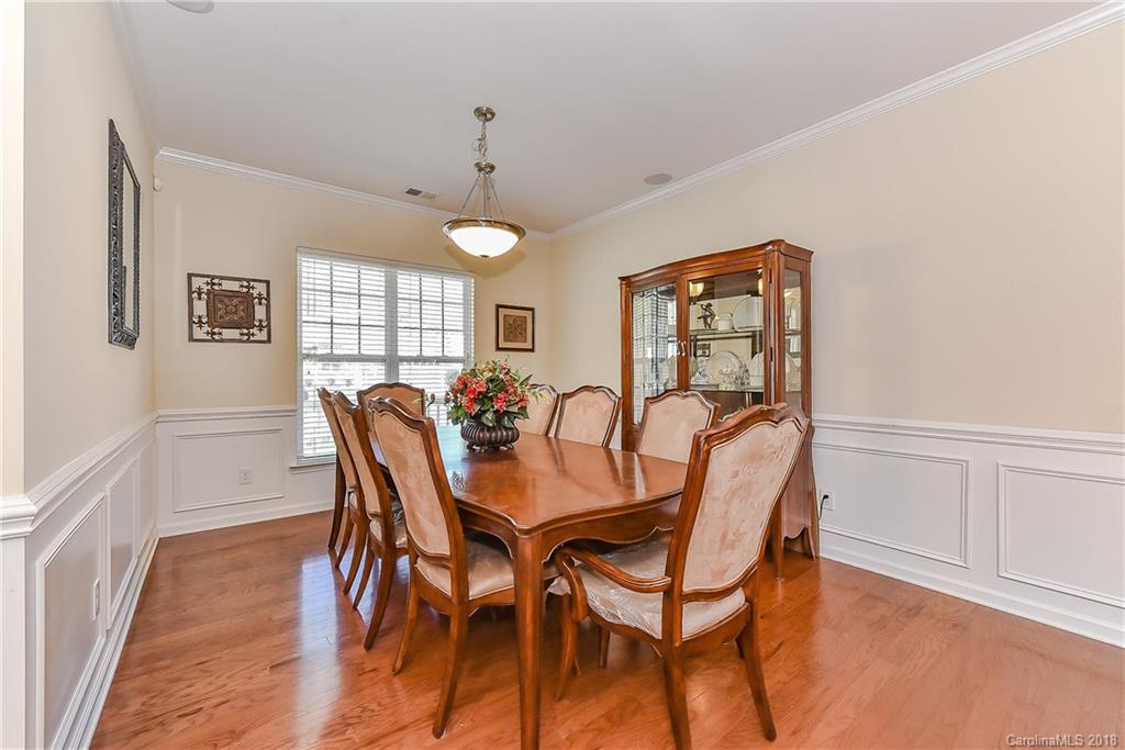 325 Sand Paver Way, Unit 99 Fort Mill, SC 29708 - Photo 5 of 25 a view of a dining room with furniture window and wooden floor