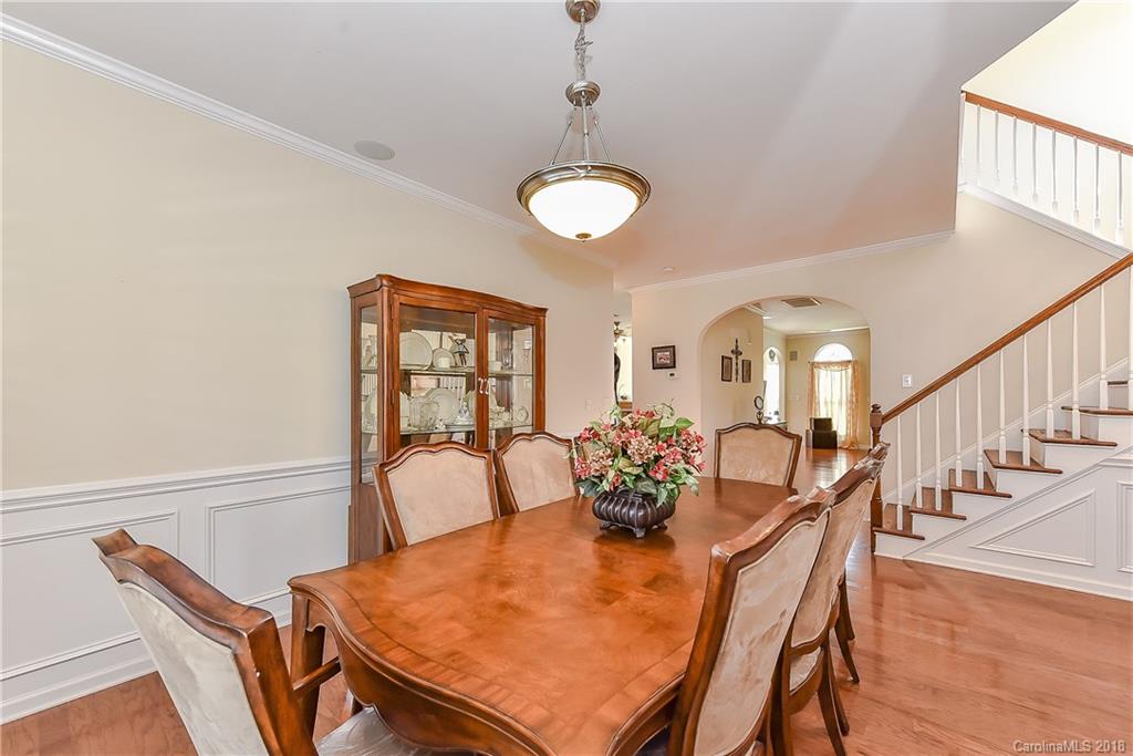 325 Sand Paver Way, Unit 99 Fort Mill, SC 29708 - Photo 6 of 25 a view of a dining room with furniture and wooden floor