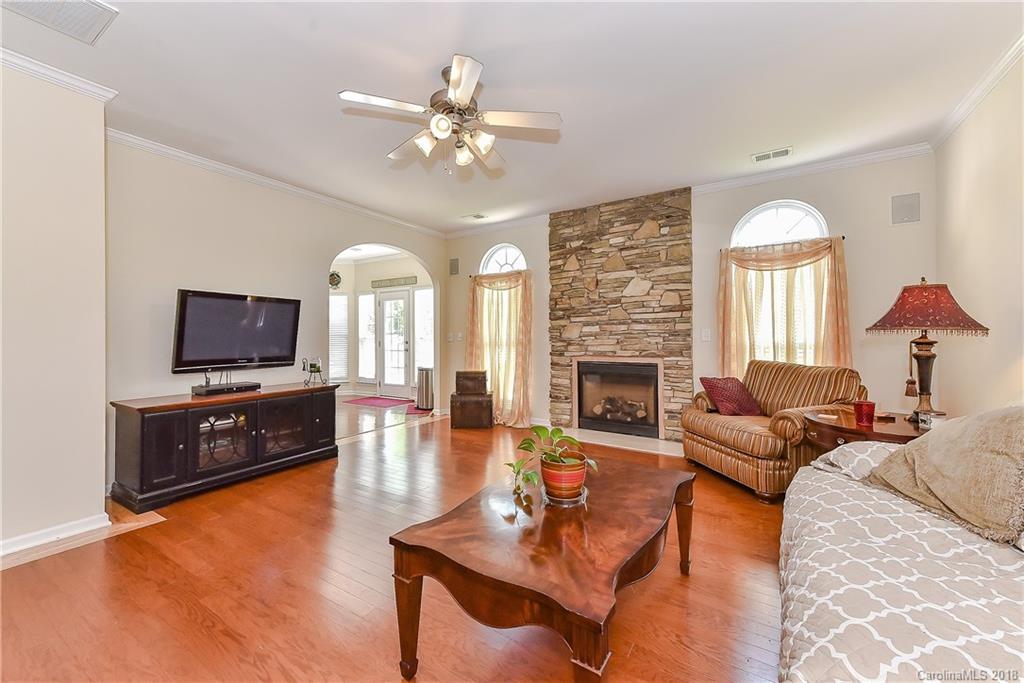 325 Sand Paver Way, Unit 99 Fort Mill, SC 29708 - Photo 9 of 25 a living room with furniture and a flat screen tv