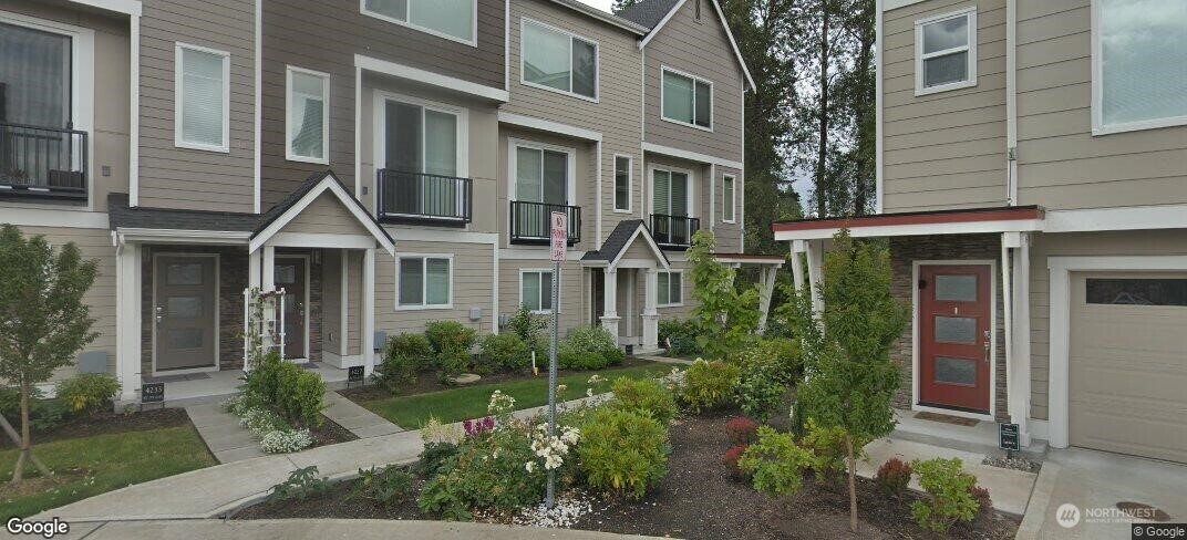 4221 Northeast 3rd Lane Renton, WA 98059 - Photo 1 of 1 a front view of a house with a yard