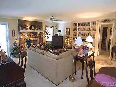 5802 Geoffrey Road Durham, NC 27712 - Photo 1 of 1 a living room with furniture and a flat screen tv