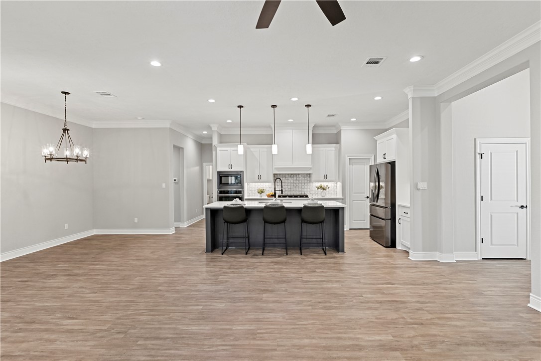 2912 GOLDBERG Drive Bryan, TX 77808 - Photo 11 of 35 a view of kitchen and kitchen island