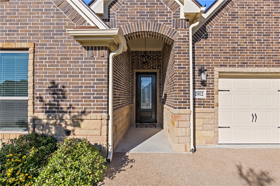 2912 GOLDBERG Drive Bryan, TX 77808 - Photo 3 of 35 a front view of a building with entryway