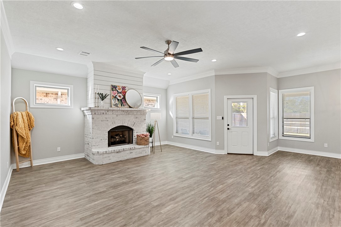 2912 GOLDBERG Drive Bryan, TX 77808 - Photo 5 of 35 a view of a livingroom with a fireplace and window