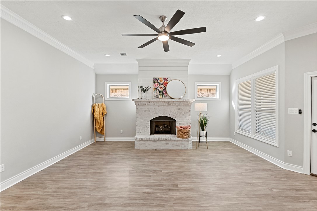 2912 GOLDBERG Drive Bryan, TX 77808 - Photo 9 of 35 a view of a livingroom with a fireplace and window