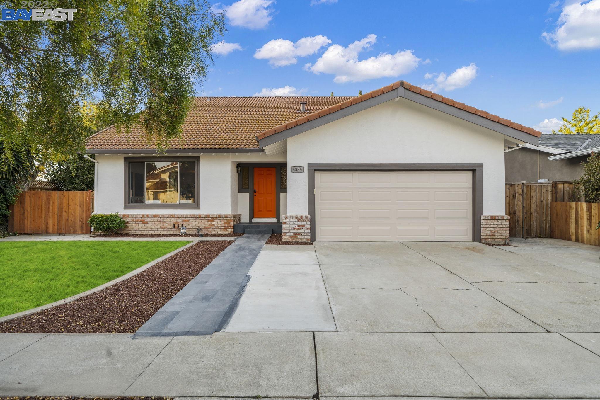 a view of a backyard of the house