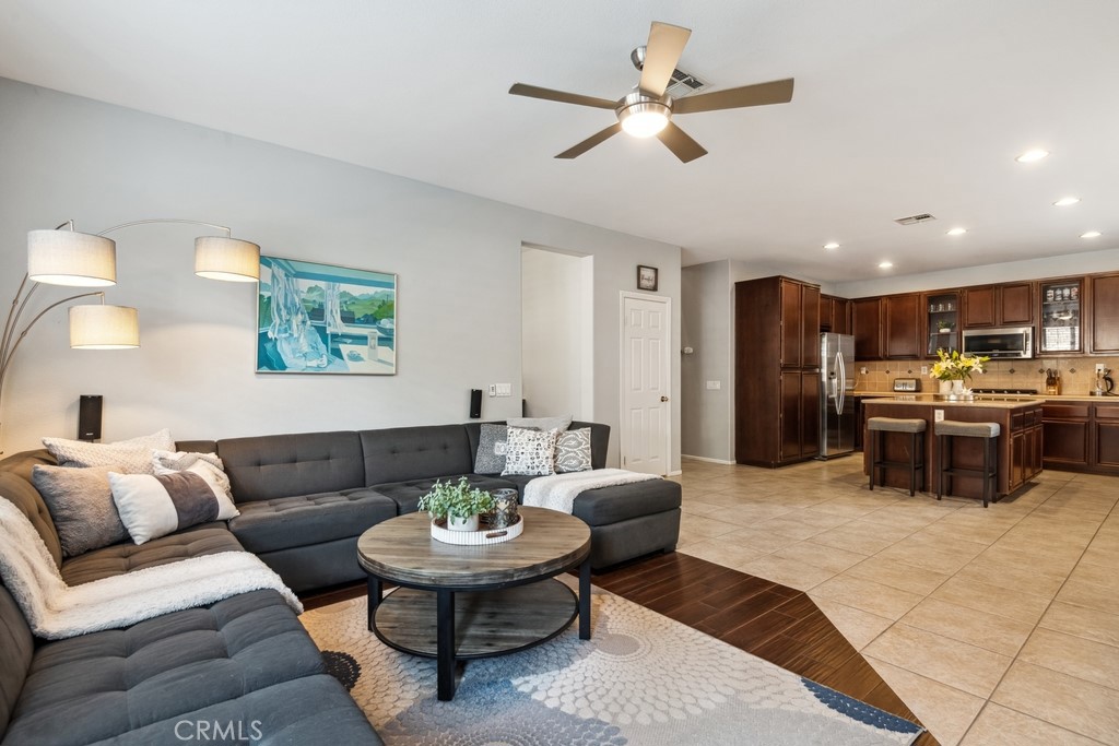 38790 Cobblestone Circle Murrieta, CA 92563 - Photo 11 of 43 a living room with furniture kitchen area and a window
